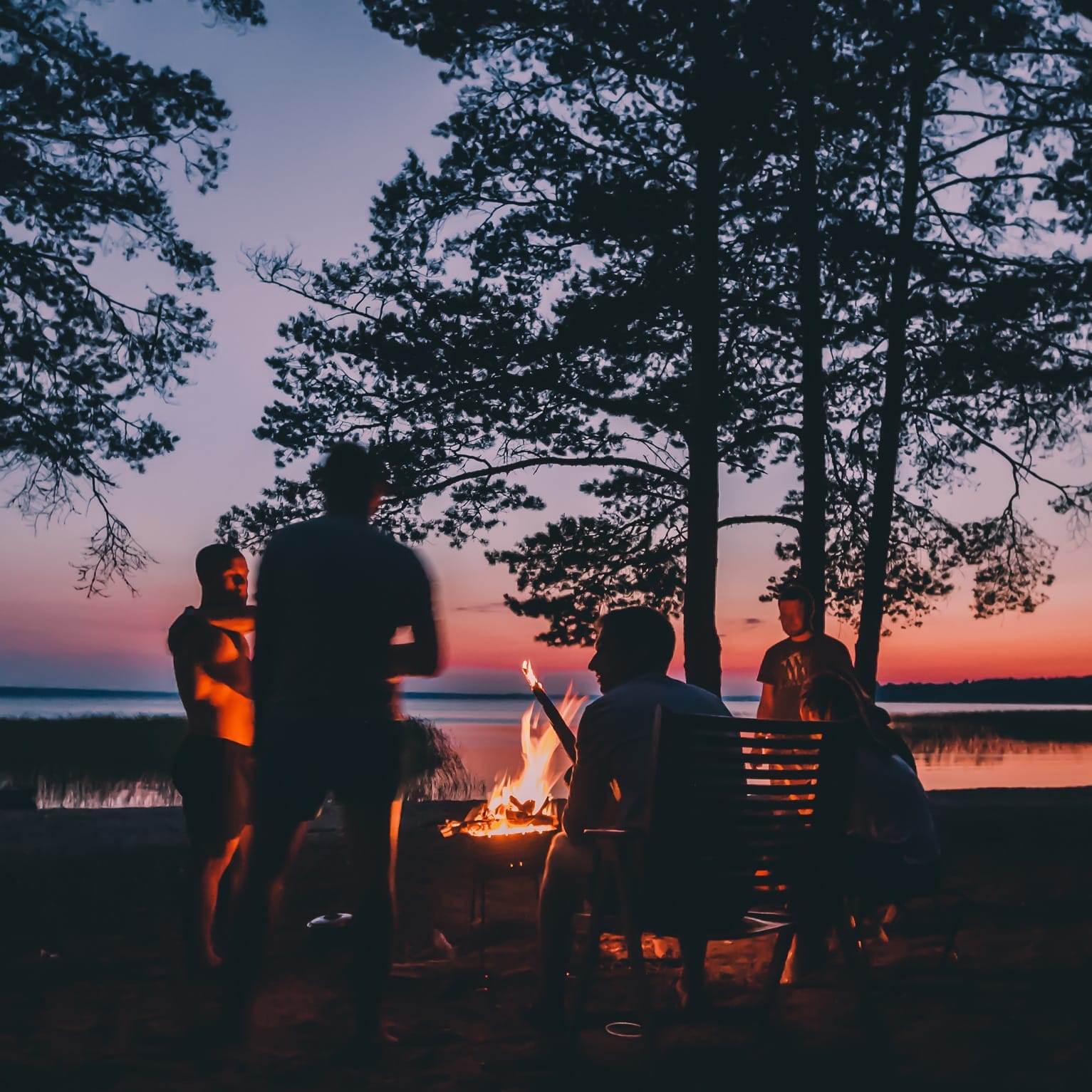 Group of friends around a campfire